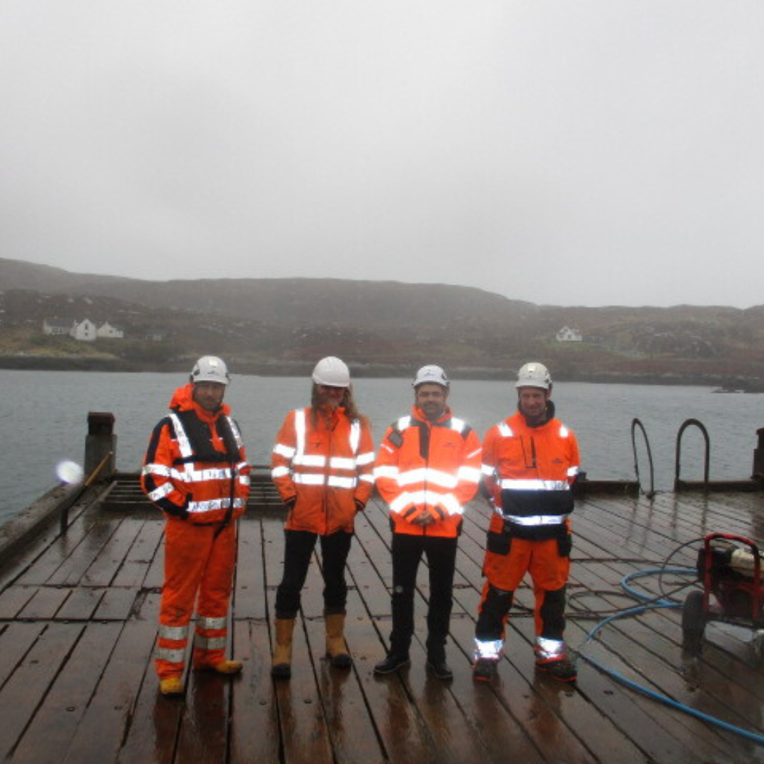 Four officers standing at Acarsaid Pier
