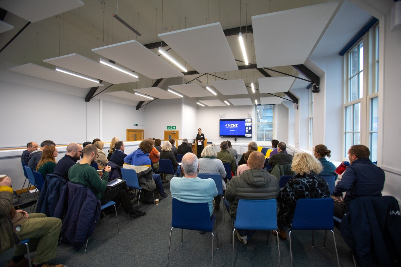 Room of people attending ICNZ open day